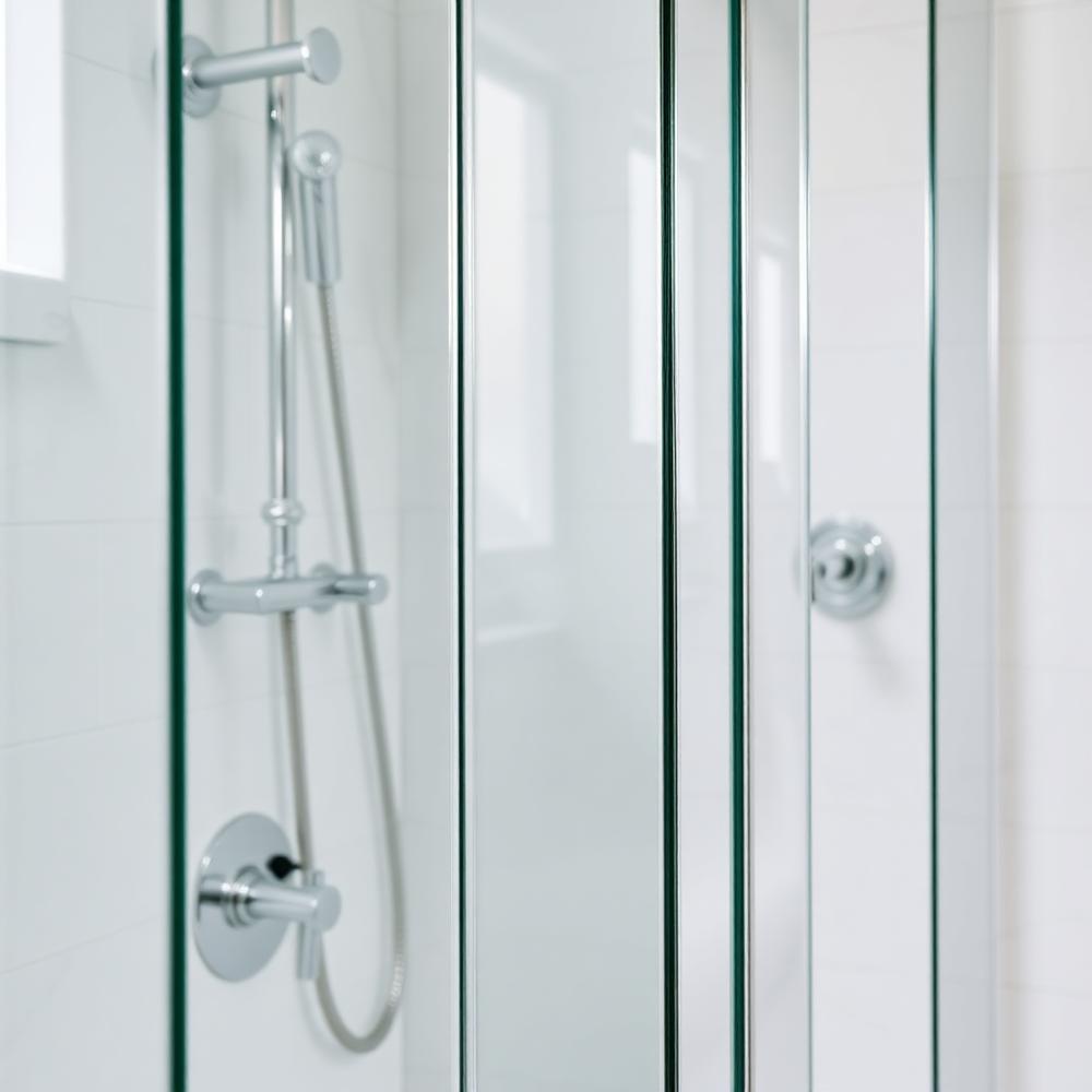Streak-free glass shower enclosure and polished chrome fixtures